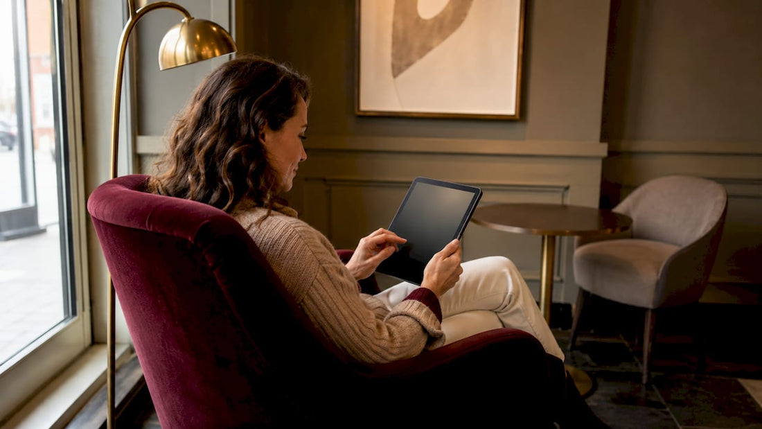 Woman browsing transitional lighting options in living room