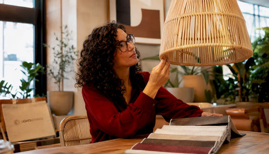 Interior designer studying rattan pendant light