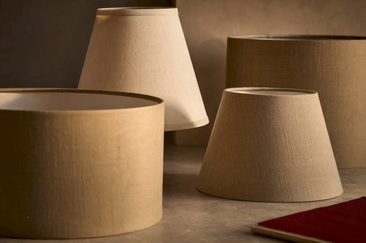Lamp shade silhouettes shaping warm room light