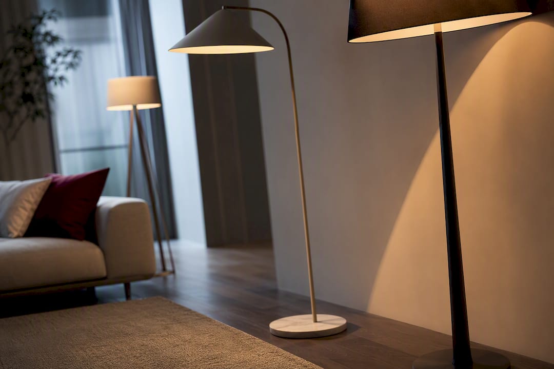 Three floor lamp silhouettes in layered lighting