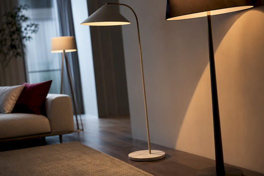 Three floor lamp silhouettes in layered lighting