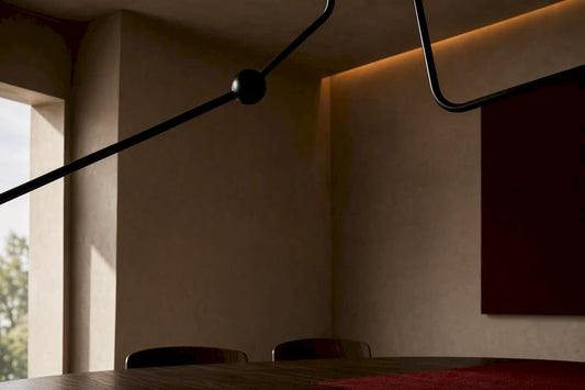 Sculptural black lighting casting shadows in dining room