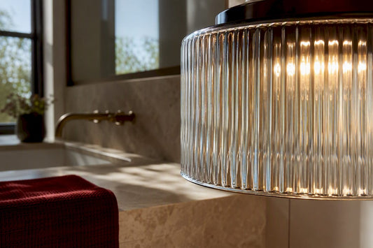 Ribbed glass shade glowing in warm interior