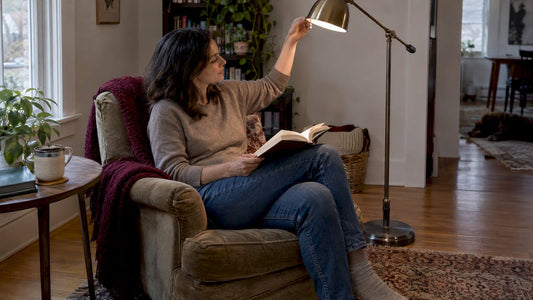 Woman reading beside adjustable floor lamp