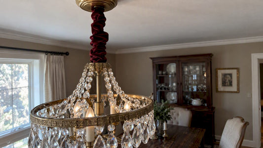 Burgundy velvet cover conceals chandelier chain