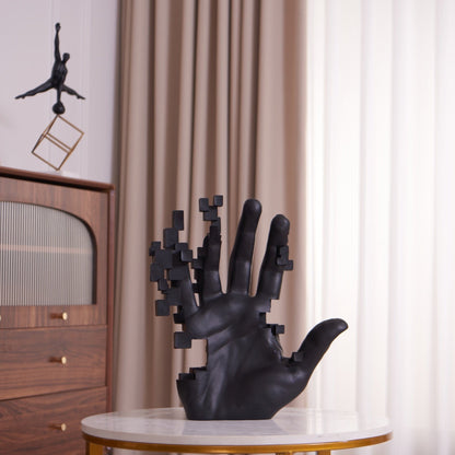 Matte black resin sculpture of pixelated hand
