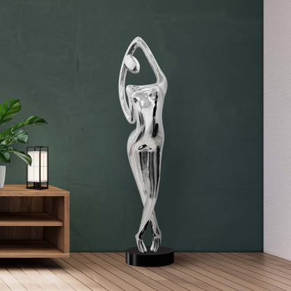 Tall chrome woman sculpture with abstract silhouette